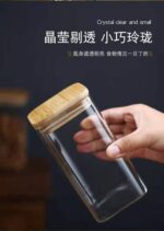 ⁦برطمان زجاج بغطاء خشبي 360 مللي لحفظ وتخزين التوابل⁩ - الصورة ⁦8⁩