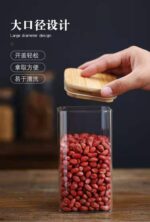 ⁦برطمان زجاج بغطاء خشبي 360 مللي لحفظ وتخزين التوابل⁩ - الصورة ⁦9⁩