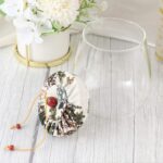 ⁦برطمان زجاج شفاف 700 ملي لحفظ البقوليات والمكسرات والكاندي بغطاء محكم الغلق مزين بقماش منقوش ورد⁩ - الصورة ⁦5⁩