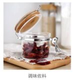 ⁦برطمان زجاج غطاء خشب بقفل 450 ملي لحفظ وتنظيم التوابل والمكسرات والبقوليات ‏⁩ - الصورة ⁦6⁩