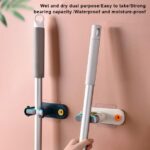 ⁦حامل ومنظم مكانس فردي من السيليكون يثبت علي الحائط بلزق دبل فيس قوي⁩ - الصورة ⁦8⁩