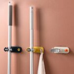 ⁦حامل ومنظم مكانس فردي من السيليكون يثبت علي الحائط بلزق دبل فيس قوي⁩ - الصورة ⁦10⁩