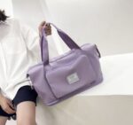 ⁦شنطة وتربروف بجزء للتعليق في يد شنط السفر قابلة للطي كبيرة لتسع كافة المتعلقات الشخصية بجيوب خارجية⁩ - الصورة ⁦2⁩