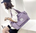 ⁦شنطة وتربروف بجزء للتعليق في يد شنط السفر قابلة للطي كبيرة لتسع كافة المتعلقات الشخصية بجيوب خارجية⁩ - الصورة ⁦4⁩