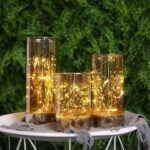 ⁦طقم شمع زجاجي 3 قطع بمقاسات مختلفة مضئ بدون لهب ببطاريات لتجديد ديكور البيت⁩ - الصورة ⁦3⁩