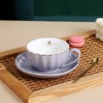 ⁦مج بورسلين شيك لشرب وتقديم الشاي والنسكافيه مع طبق ومعلقة استانليس ستيل ويد⁩ - الصورة ⁦5⁩