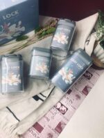 ⁦طقم علب 4 قطع بمقاسات مختلفة لحفظ وتنظيم البقوليات والحبوب والكاندي بغطاء محكم الغلق بيد من الاكليريك⁩ - الصورة ⁦5⁩