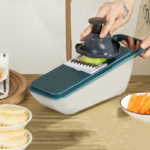 ⁦قطاعة ومبشرة يدوية للخضراوات والفواكه والجبن 5 رؤوس مع صفاية وعلبة عملية وسهلة الاستخدام بيد⁩ - الصورة ⁦7⁩