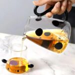 ⁦براد لحمل وتقديم الشاي واللبن والعصائر شكل بقرة 550 ملي بغطاء يستخدم كوب بيد⁩ - الصورة ⁦9⁩