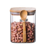 ⁦برطمان زجاج لحفظ وتنظيم البقوليات والمكسرات والكورن فليكس 800 ملي بغطاء خشبي ومعلقة لسهولة الأستخدام⁩ - الصورة ⁦3⁩