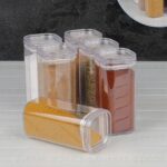 ⁦طقم 12 برطمان بغطاء محكم الغلق مع 3 ارفف لحفظ وتنظيم التوابل من الاكليريك⁩ - الصورة ⁦3⁩