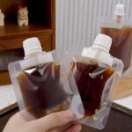 ⁦كيس 30 ملي لحمل الشامبو والشاور جل والكريمات للسفر والرحلات قابل لإعادة الملئ⁩ - الصورة ⁦2⁩