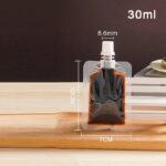 ⁦كيس 30 ملي لحمل الشامبو والشاور جل والكريمات للسفر والرحلات قابل لإعادة الملئ⁩ - الصورة ⁦5⁩