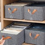 منظم ملابس للدواليب والادراج بيد قابل للطي