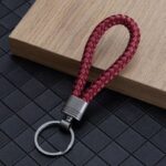 ⁦ميدالية مضفرة من الجلد لمفاتيح السيارة والمنزل وشنط السفر مع جزء لكتابة رقم الموبايل⁩ - الصورة ⁦7⁩