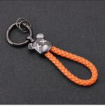 ⁦ميدالية جلد مضفر برأس دبدوب لمفاتيح السيارات والشنط مع جزء مخصص لكتابة رقم الموبايل⁩ - الصورة ⁦6⁩