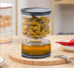 برطمان مخللات اكليريك 250 ملي علي شكل ساعة رملية بغطاء محكم الغلق مزود بشوكة