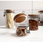 برطمان زجاج غطاء خشب بقفل 450 ملي لحفظ وتنظيم التوابل والمكسرات والبقوليات ‏