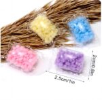 ⁦مجموعه حبيبات معطرة 50 قطعه للملابس اثناء الغسيل برائحة منعشة⁩ - الصورة ⁦2⁩