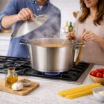 ⁦حلة استانلس ستيل تركي مقاس 24 * 12سم بغطاء ويدين لسهولة الحمل⁩ - الصورة ⁦2⁩