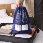 شنطة لحفظ الأحذية داخل شنط السفر بجزء شفاف ورباط للغلق