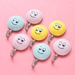 ⁦طقم هوك لاصق 2 قطعة شكل سمايل فيس لتعليق المفاتيح والكابات⁩ - الصورة ⁦2⁩